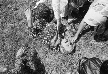 A woman collapses in grief at the memorial centre at Potocari, near Srebrenica, during a mass burial of some of the victims of the massacre. An estimated 8,000 Bosniak (Muslim) men and boys from Srebr...
