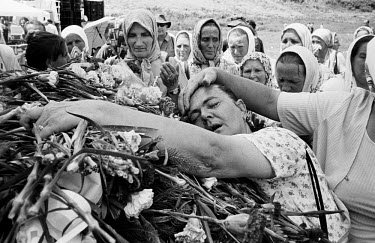Mourning women at the memorial centre at Potocari, near Srebrenica, during a mass burial of some of the victims of the massacre. An estimated 8,000 Bosniak (Muslim) men and boys from Srebrenica were m...