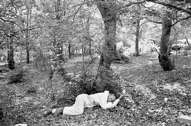 A worker from the Bosnian Commission for Missing Persons takes a break from recovering the remains of Muslims murdered by Serb paramilitaries during their campaign of ethnic cleansing. Around 250,000...