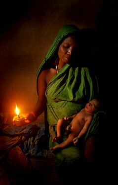 Laxmi Dehuey with her newborn baby, not yet named. In Orissa in 2001, there were 367 maternal deaths per 100,000 births, down from 738 in 1993.