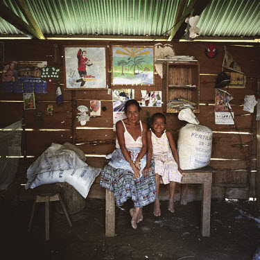 Mother Lucia Cac (52) with her daughter Cleotilde Cholom Cac (9), who is one of twelve children. Lucia says ^I wanted to go to school but my parents weren't supportive. Anyway, in the community where...