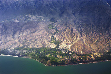 Aerial view of the coast of the island. Almost all of the mountains in Haiti have been affected by deforestation, which causes flooding and accelerates erosion in the area. The wood is cut by farmers...