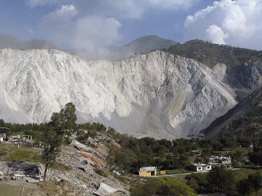 A landslide brought down the entire side of a mountain during the earthquake which struck Pakistani-administered Kashmir on 08/10/2005. At least 40,000 people were killed by the 7.6 magnitude earthqua...