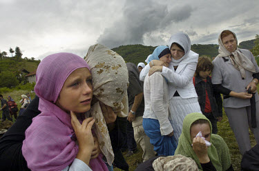 Mourners at the mass burial of 610 recently-identified victims of the Srebrenica massacre which took place to commemorate its tenth anniversary. An estimated 8,000 Bosniak (Muslim) men and boys from t...