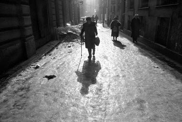 An elderly man carries food home through the ice covered streets during the siege on Sarajevo by Serb troops. Gas and electricity were cut off for long periods during the 4-year siege, in which over 1...