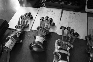 Prosthetic hands are laid out on a table at a rehabilitation centre for the wounded and disabled.  Over 10,000 people were killed and more than 60,000 were injured in the 4-year long siege on Sarajevo...