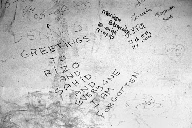 Graffiti written on a wall by United Nations (UN) soldiers at the Dutch Battalion base in Srebrenica, which fell to Serb forces on 10th July 1995.  It reads 'Greetings to Rizo and Sahid and everyone I...