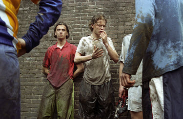 Middle class Dutch teenagers get cold and muddy during an Easter camp in the countryside, involving outdoor pursuits such as climbing and obstacle course races.