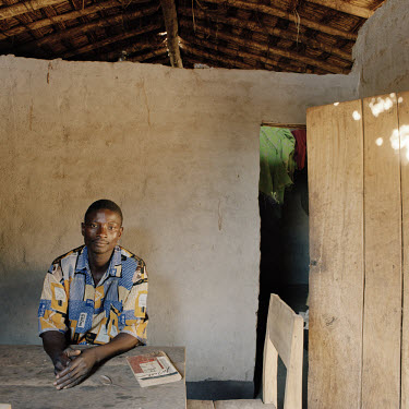 Luka Eliamu (23) is married with one child. He sits at the table in his house next to a copy of Shakespeare's 'Julius Caesar', which he reads every day. Luka hopes to stop farming in the next few year...