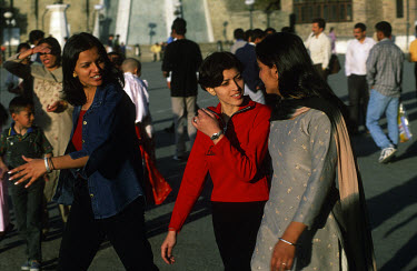 Middle class young Indian young women chat as they promenade at the Ridge. This hill station in the Himalayas was formerly the summer capital of India during the Raj era.