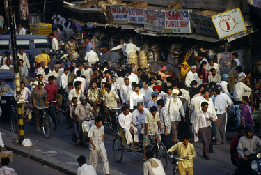 Commuters crowd the streets during rush hour in Old Delhi.