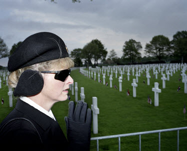 A security woman pays her respects as US president George Bush and Queen Beatrix visit the Margraten American military cemetery for a ceremony marking the 60th anniversary of VE Day. 8,000 soldiers ki...
