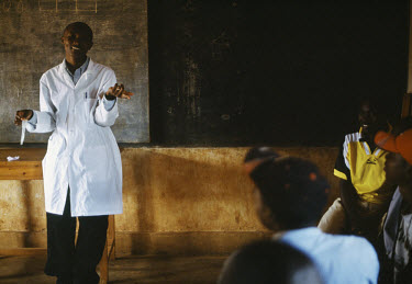Health educator Theogene Niyongana gives a lecture on HIV and AIDS to a group of people waiting to be tested for the virus at Kibayi Health Centre.  By addressing their status, sufferers learn how to...