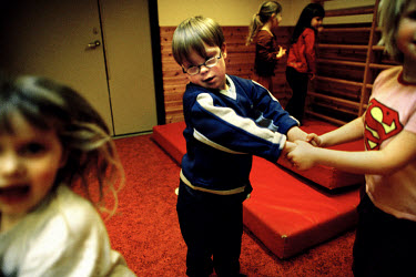 Jesper takes part in exercises in the nursery school which he attends with children one or two years younger than himself.  Six year old Jesper has Down Syndrome and although he is unable to talk, com...