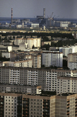 Apartment blocks in Pripyat, with the Chernobyl nuclear power station in the background. The town, once home to 30,000 people, has been abandoned ever since the Chernobyl nuclear accident on 26/04/198...
