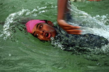 A young girl swims in the practice pool at the National Sports Training Institute.