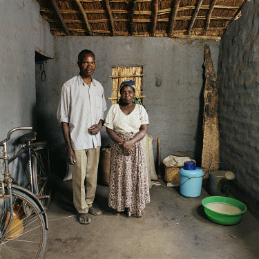 Hopeson Thunde (55) with his wife Lusiya Kalichero stand in the main room in their house, where they keep their bicycle.   The village of Dickson contains 55 households and some 300 inhabitants. In 20...