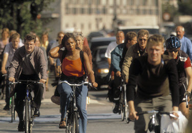 Commuters cycle home from work in the rush hour.