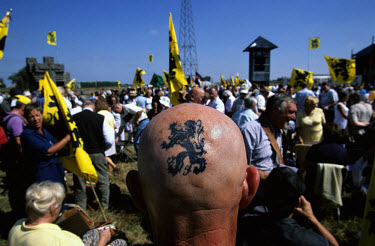 An ultra right wing Flemish radical displays his Flemish lion tattoo with pride during Ijzerwake ('Yser Vigil'). As well as being a yearly event to remember the Flemish soldiers who died during World...