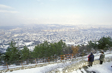 View over the city in the snow.