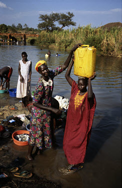 Villagers wash and collect water from the Yei River, which is believed to be carrying cholera. The influx of Internally Displaced Persons (IDPs) to the area has put added pressure on local water sourc...