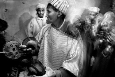 Musicians play the qarqba, large metal castanets, during the traditional performance, or Lila, of the Gnaoua festival.  Gnaoua music in the region, which dates back to the 16th century and has origins...