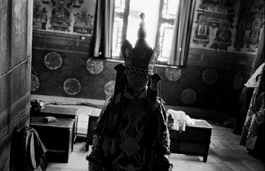 A young Tibetan Buddhist monk prepares for a traditional dance in Shechen monastery. About 300 monks live in the monastery, from a total of around 20,000 Tibetans living in exile in Nepal.