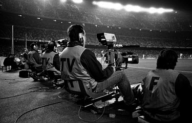 TV cameramen cover a football match in Camp Nou, the stadium of FC Barcelona.
