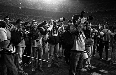 Photographers cover a football match in Camp Nou, the stadium of FC Barcelona.