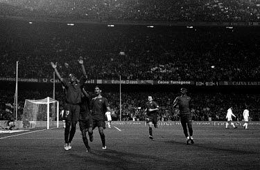 FC Barcelona football players rush to congratulate Ronaldinho after his goal in the match against Real Madrid, 'El Clasico', at Camp Nou.