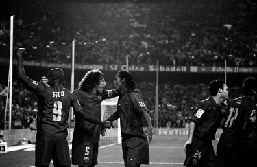 FC Barcelona football players Samuel Eto'o, Carles Puyol and Ronaldinho celebrate the latter's goal in the match against Real Madrid, 'El Clasico', at Camp Nou.