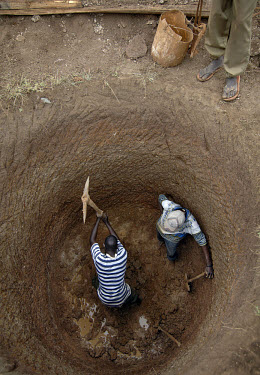 Students from AMREF (African Medical and Research Foundation) dig a well in a village. One of the aims of AMREF is to provide water supplies to communities whose means of collecting water would otherw...