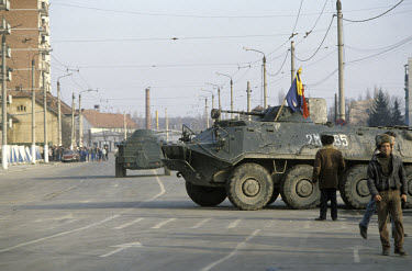 Army tanks on street.