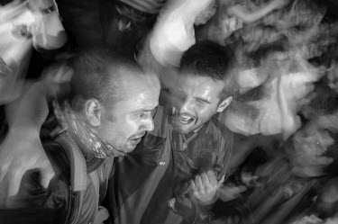Fans of FC Barcelona celebrate at the final whistle after watching live coverage of their football team winning the final of the 2006 Champions League tournament.
