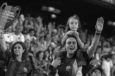 Fans of FC Barcelona gather at Camp Nou to welcome home their football team after they had won the 2006 Champions League tournament.