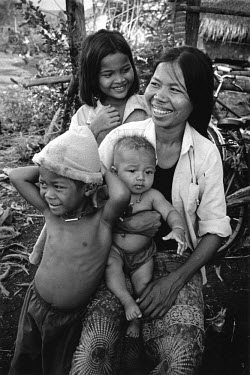A family living on land in an area which has been cleared of landmines and unexploded ordnance (UXO) by the Mines Advisory Group (MAG).