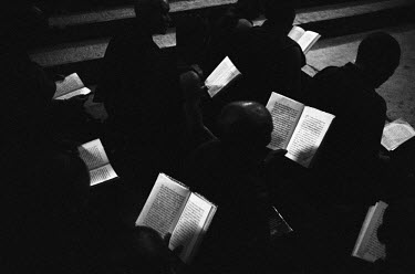 Exiled Tibetan nuns read the sutra at night in a convent.