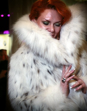 Fashion designer Julia Helen shows off her fur coat at the 2006 Millionaire Fair in Moscow. Dozens of extravagant products, designed to appeal to the growing Russian millionaire market, were on displa...
