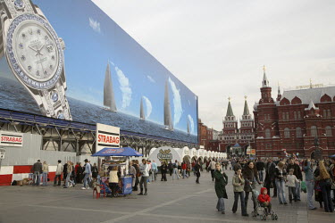 A huge billboard advertises Rolex watches near Red Square.