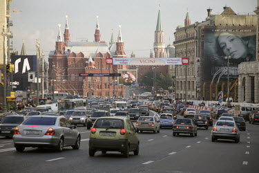 Advertising billboards hang over the cars stuck in a traffic jam near Red Square.
