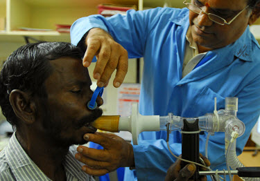 A tuberculosis (TB) patient undergoes a breath test during a check-up by a doctor at the Tuberculosis Research Centre (TRC), a facility supported by the TB Alliance (the Global Alliance for TB Drug De...