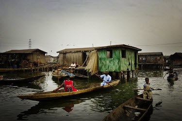 Pirogues in the Makoko district, where houses are built on stilts.