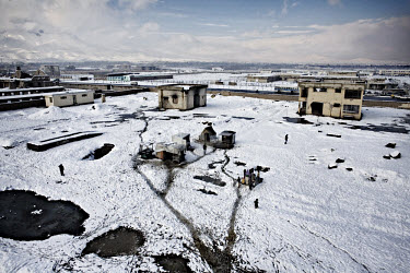 A view from the roof of the old Ryasat-5 office building of Afghan returnees living amidst the ruins on the outskirts of Kabul. More than 800 returned refugees now live without any basic facilities in...