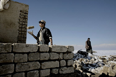 Afghan returnees building houses in a deserted area of the Shomali plains. The Afghan government provided this land for the refugees in order to relocate them from the capital. However, most of the re...