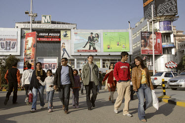 Shoppers outside the Metropolitan Mall, New Delhi's most upmarket shopping centre, in the suburb of Gurgaon. Its poorer residents have been displaced to make way for gentrification and the growing dem...