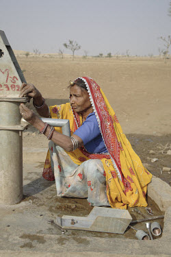 Sita, 55, is a Dalit (untouchable) woman who has been trained by the Barefoot College as a hand pump mechanic. Upper caste villagers formerly refused to use any wells that were touched by Dalits since...