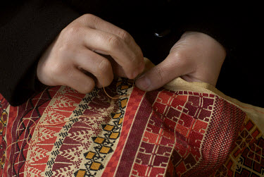 A woman with traditional embroidery.