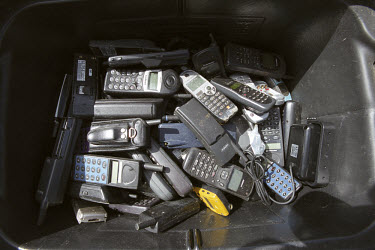 A pile of unwanted mobile phones at a recycling collection centre in West London.
