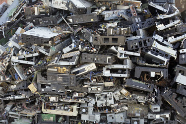 A stack of electronic trash at an e-waste recycling workshop. Every year Guiyu receives more than a million tons of computer waste from countries all over the world. About 100,000 e-waste workers make...