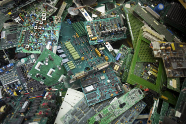 Discarded motherboards from old computers wait to be dismantled and stripped of the metal that they contain at an e-waste recycling workshop. Every year Guiyu receives more than a million tons of comp...